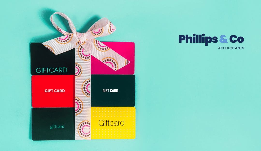 Six gift cards wrapped up in a bow.